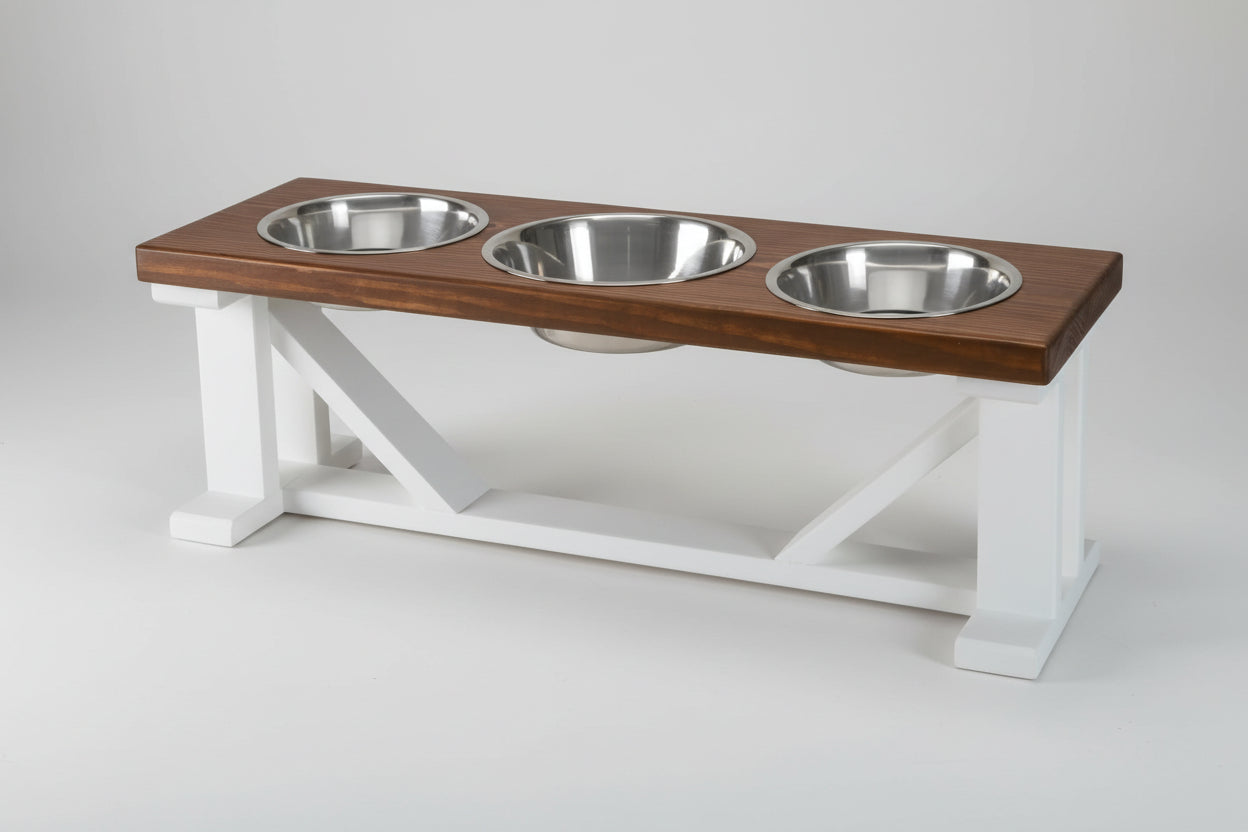 Wooden pet feeding station with three metal bowls on a white background