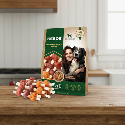 Dog treat package with Kebob and Digestible Sticks branding, featuring a woman and dog on the packaging.