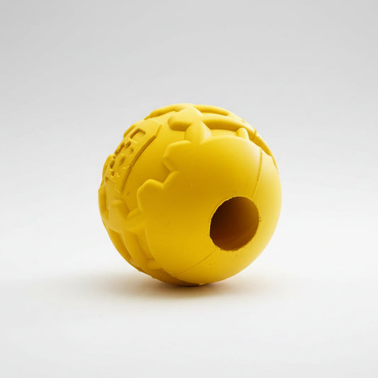Yellow textured ball toy on a white background