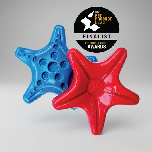Two star-shaped dog toys, one blue and one red, with a '2021 Pet Product News Finalist Editors' Choice Awards' badge on a white background.